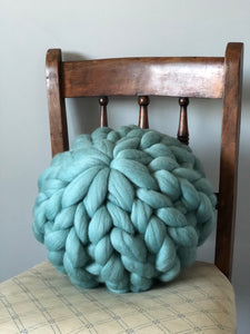 Round chunky knit merino cushion